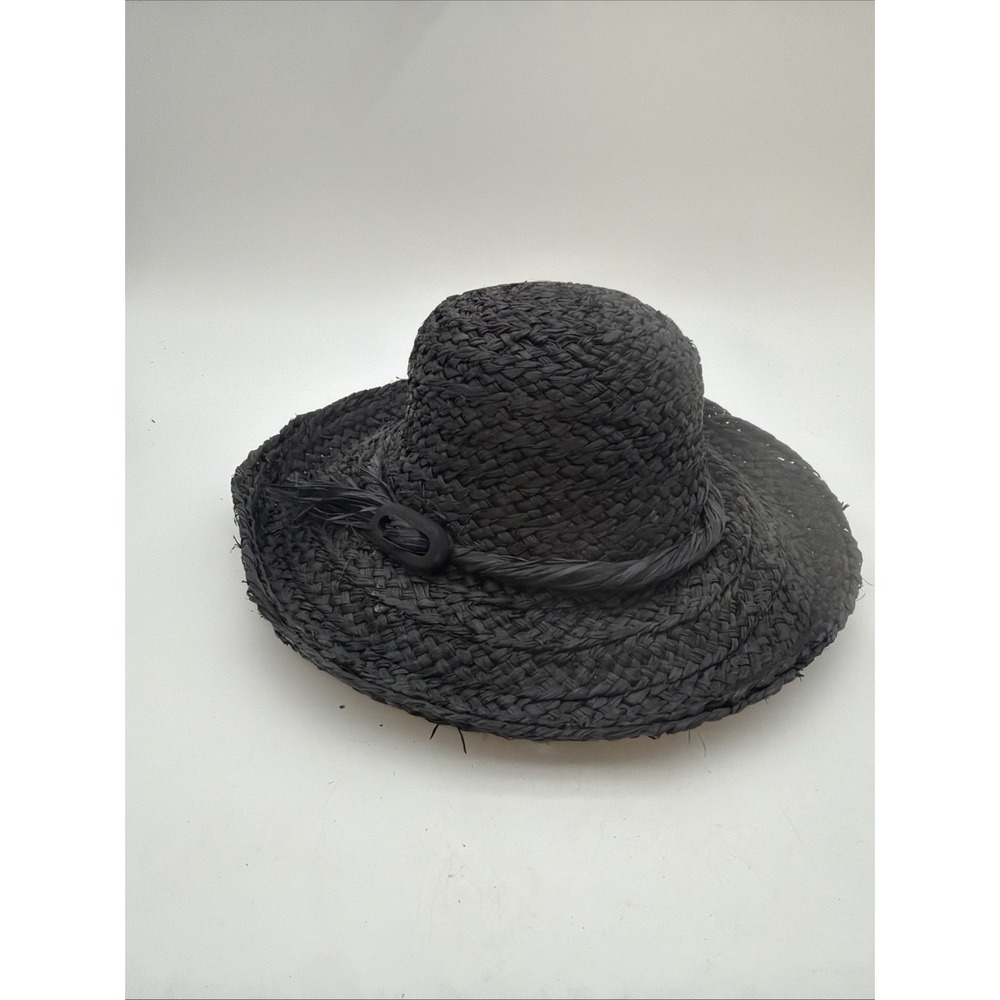 black woven straw sun hat featuring a textured crown
